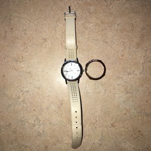 Watch with interchangeable face plate